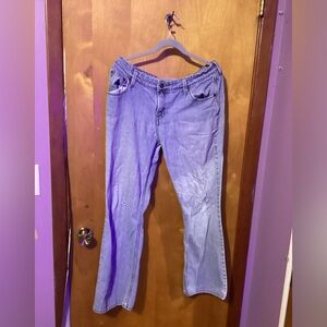 This pair of used jeans are the brand signature. Size 14